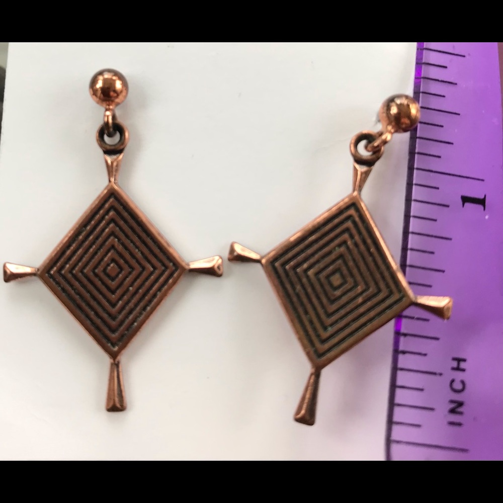 Geometric copper/brass post earrings.
